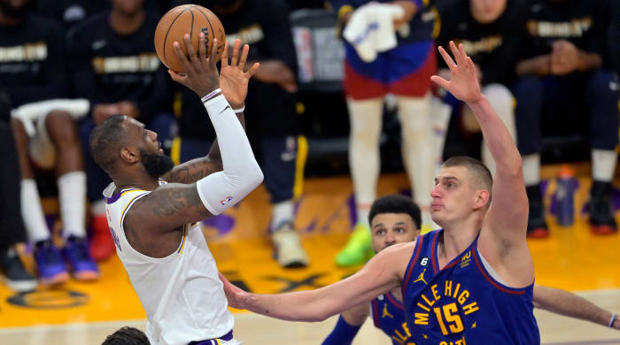 LeBron James shoots against the Nuggets